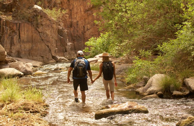 Couple hiking in Aravaipa Canyon Wilderness